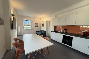 Soggiorno con cucina a vista